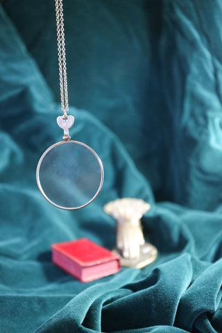 Antique golden opticians test lens necklace