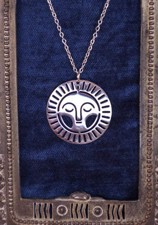 Silver sun face necklace